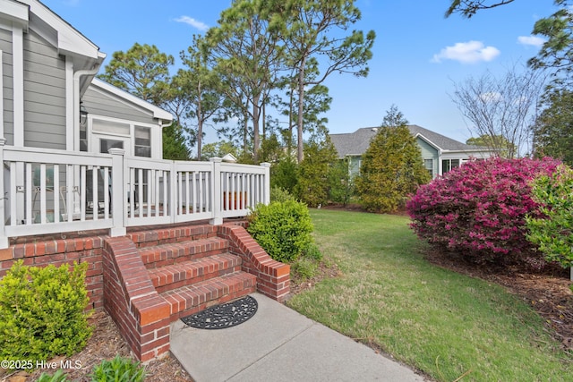4106 Kittiwake Ct, Southport, NC 28461 - view of green lawn featuring a sunroom