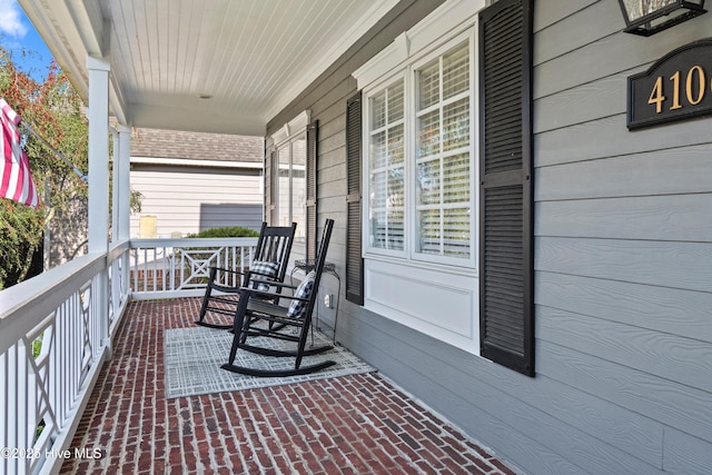 4106 Kittiwake Ct, Southport, NC 28461 - balcony with covered porch