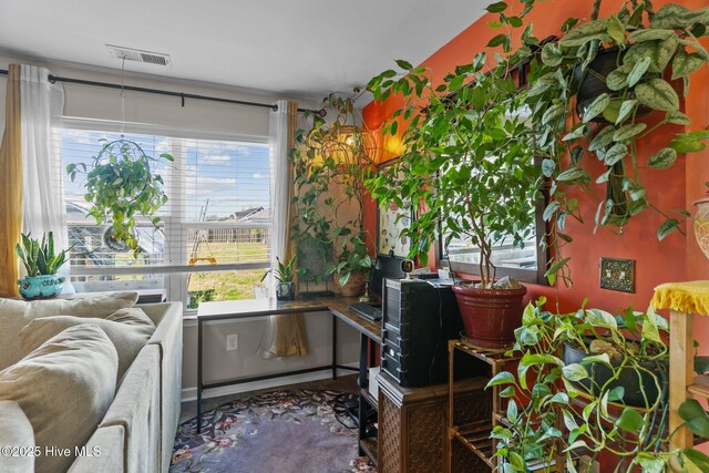 living area featuring visible vents