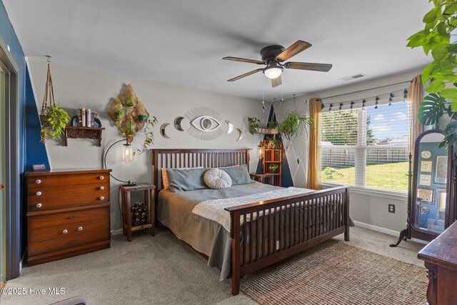 bedroom with ceiling fan, visible vents, baseboards, and carpet floors