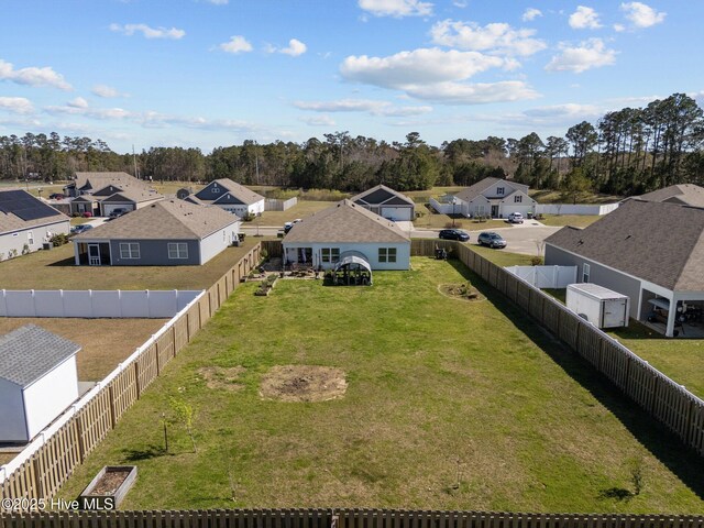 view of yard featuring a garden and a fenced backyard