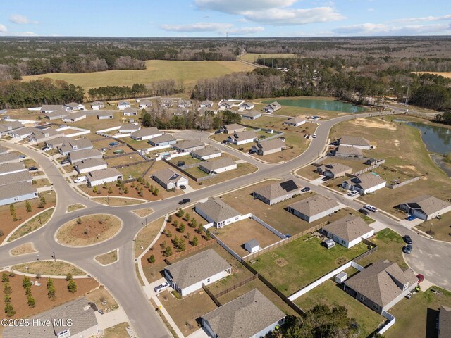 aerial view with a water view and a residential view