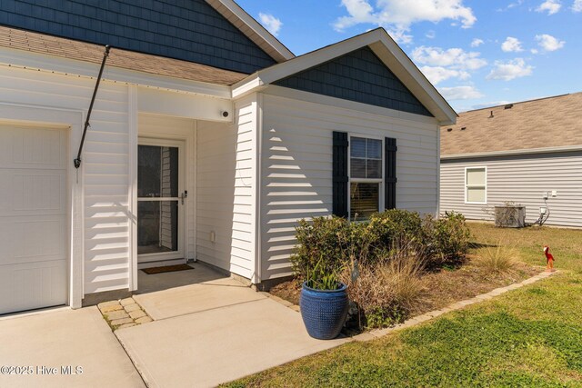 doorway to property with a yard