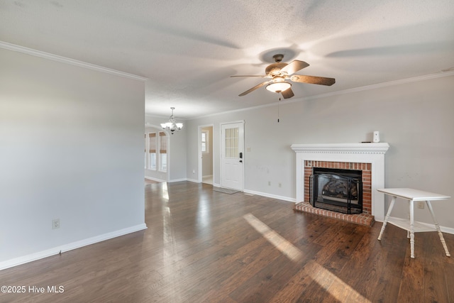 unfurnished living room with a fireplace, wood finished floors, ceiling fan with notable chandelier, and ornamental molding