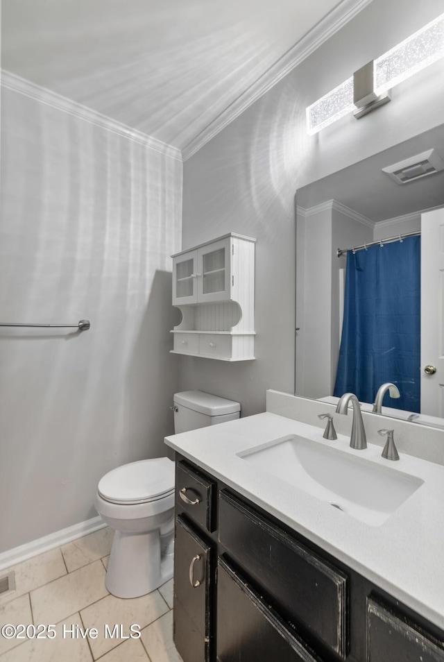 bathroom featuring vanity, toilet, ornamental molding, tile patterned floors, and visible vents