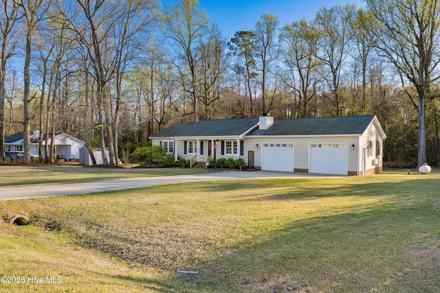 single story home with concrete driveway, an attached garage, crawl space, a front yard, and a chimney