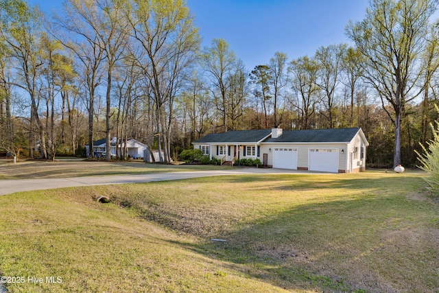 ranch-style home with a front yard, concrete driveway, a chimney, crawl space, and a garage