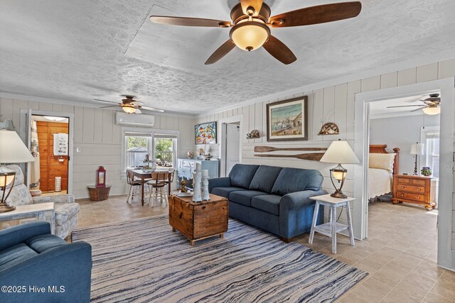 3582 Norman Dr SW, Supply, NC 28462 - living room featuring ceiling fan, a wall unit AC, a textured ceiling, light tile patterned flooring, and wood walls
