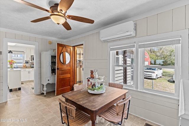 3582 Norman Dr SW, Supply, NC 28462 - dining room with a wall unit AC, healthy amount of natural light, a textured ceiling, and ceiling fan