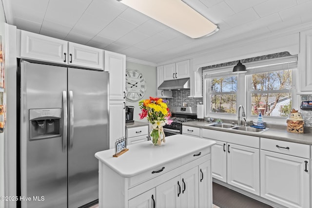 3582 Norman Dr SW, Supply, NC 28462 - kitchen with appliances with stainless steel finishes, under cabinet range hood, a sink, white cabinets, and ornamental molding