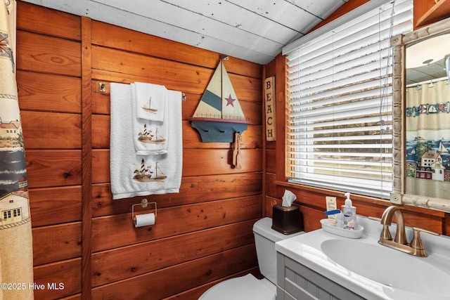 3582 Norman Dr SW, Supply, NC 28462 - full bath featuring vanity, toilet, wood walls, and curtained shower