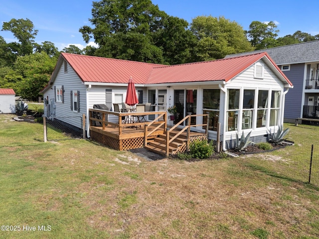 3582 Norman Dr SW, Supply, NC 28462 - rear view of property featuring a wooden deck, a sunroom, and metal roof