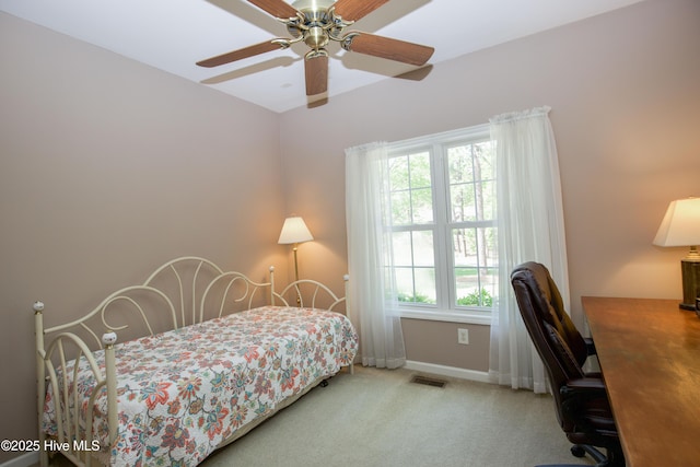 bedroom featuring ceiling fan, visible vents, baseboards, and carpet