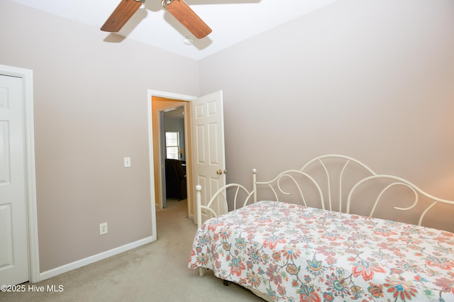 carpeted bedroom with baseboards and ceiling fan
