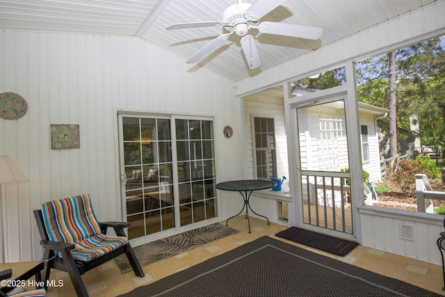 sunroom / solarium featuring a wealth of natural light and ceiling fan