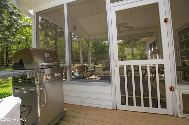 exterior space with area for grilling and a sunroom