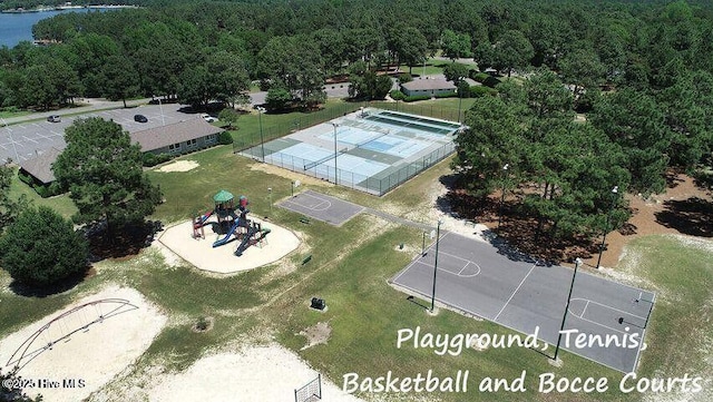birds eye view of property with a view of trees