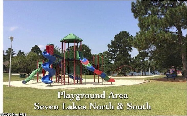 community play area with a lawn