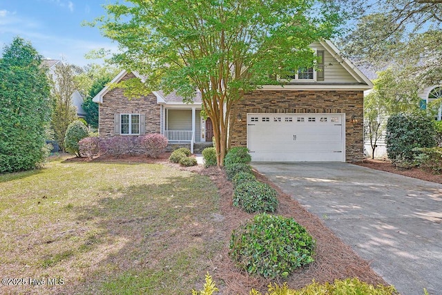 view of front facade featuring stone siding, a porch, concrete driveway, an attached garage, and a front lawn