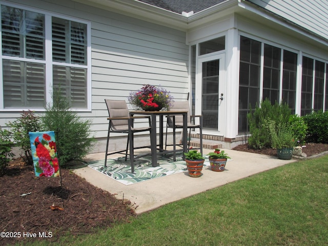 1381 Ellsworth Dr SW, Ocean Isle Beach, NC 28469 - view of patio / terrace featuring a sunroom
