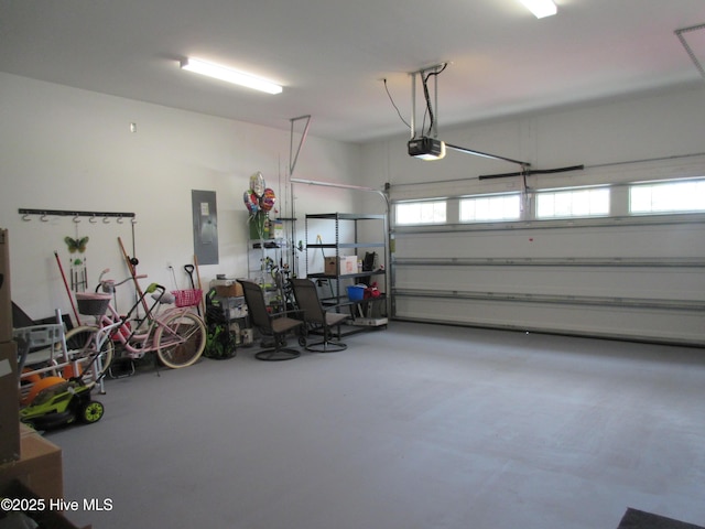 1381 Ellsworth Dr SW, Ocean Isle Beach, NC 28469 - garage featuring electric panel and a garage door opener