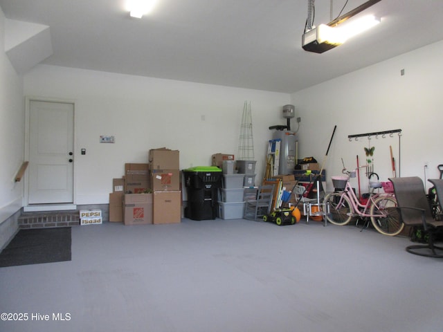1381 Ellsworth Dr SW, Ocean Isle Beach, NC 28469 - garage featuring a garage door opener and water heater