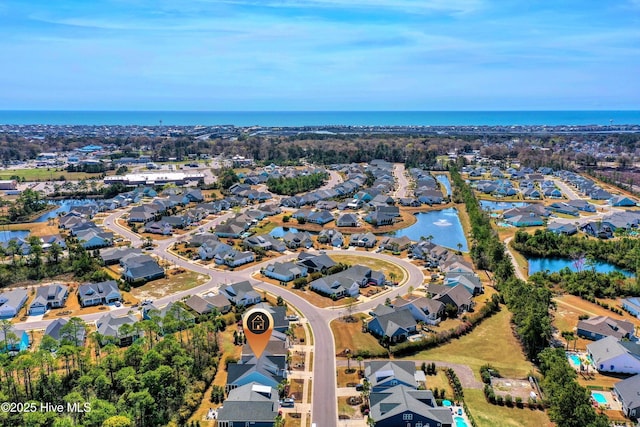 1381 Ellsworth Dr SW, Ocean Isle Beach, NC 28469 - aerial overview of property's location with a nearby body of water and nearby suburban area