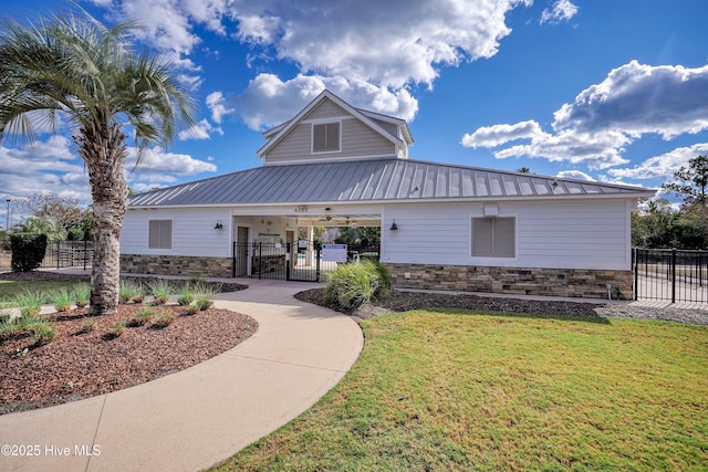 1381 Ellsworth Dr SW, Ocean Isle Beach, NC 28469 - view of building exterior featuring a fenced front yard