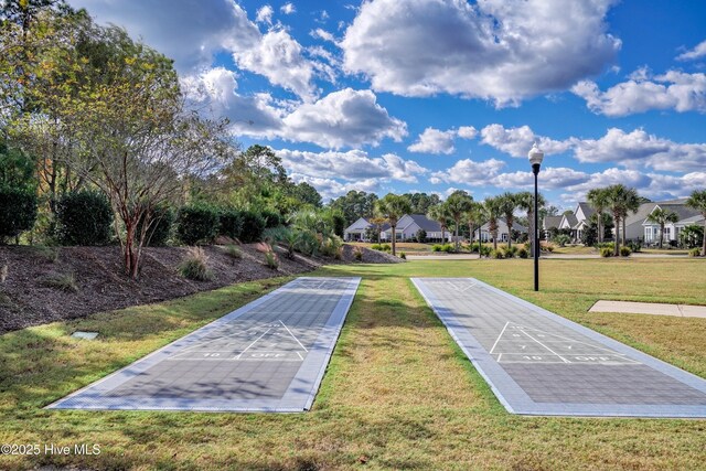 1381 Ellsworth Dr SW, Ocean Isle Beach, NC 28469 - view of home's community with shuffleboard, a residential view, and a lawn