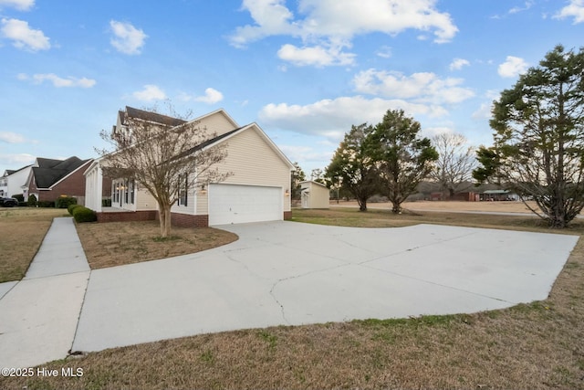 view of property exterior featuring a lawn, a garage, and concrete driveway