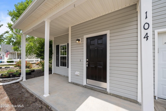 doorway to property with covered porch