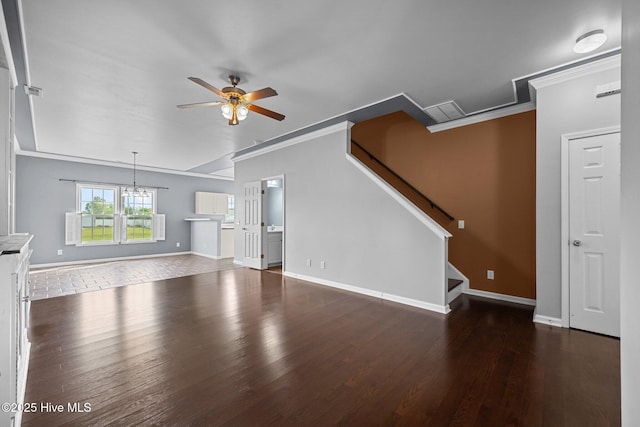 unfurnished living room with stairway, crown molding, ceiling fan with notable chandelier, and wood finished floors