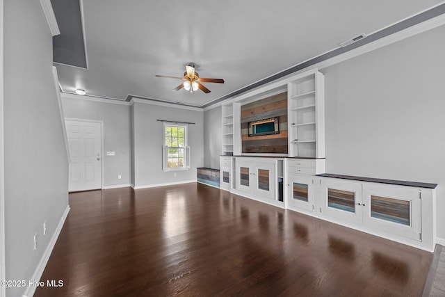 unfurnished living room with crown molding, a ceiling fan, baseboards, and wood finished floors