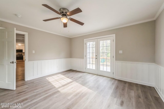 208 Elm St, Whiteville, NC 28472 - unfurnished room with a wainscoted wall, wood finished floors, french doors, and a ceiling fan