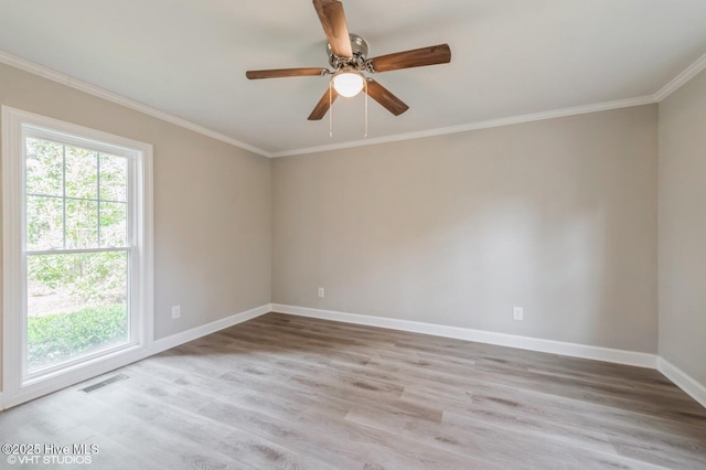 208 Elm St, Whiteville, NC 28472 - unfurnished room featuring visible vents, crown molding, baseboards, wood finished floors, and a ceiling fan