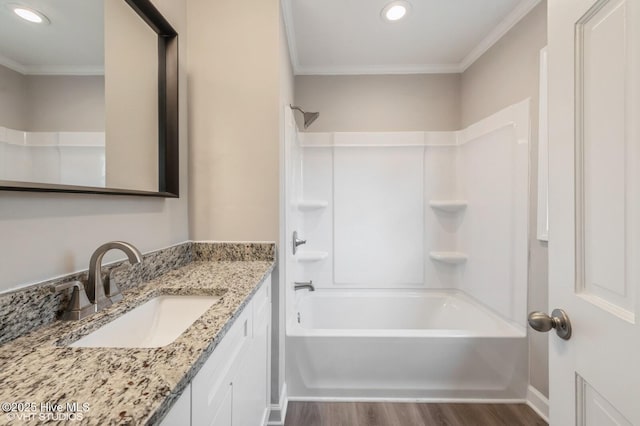 208 Elm St, Whiteville, NC 28472 - bathroom with ornamental molding, wood finished floors, shower / bath combination, and vanity