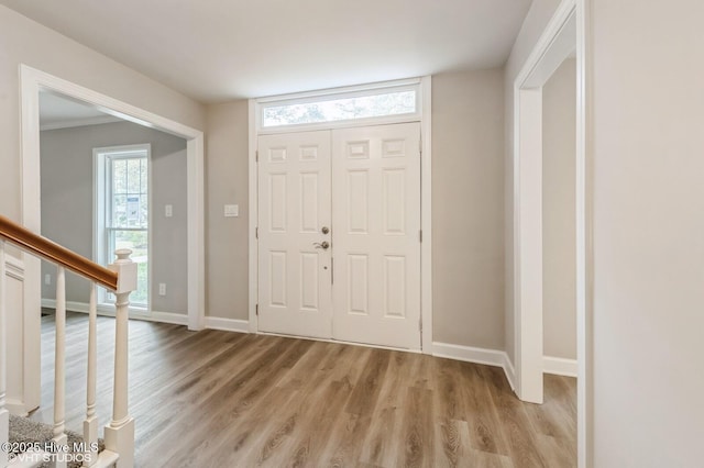 208 Elm St, Whiteville, NC 28472 - entrance foyer with baseboards, stairs, and light wood finished floors