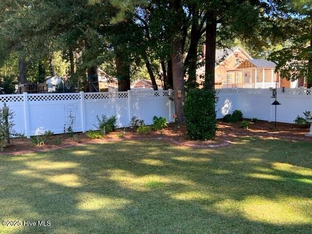view of yard with a fenced backyard