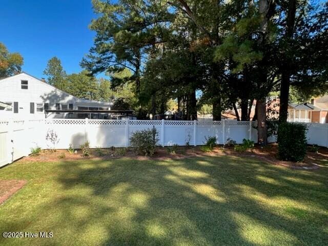 view of yard with a fenced backyard