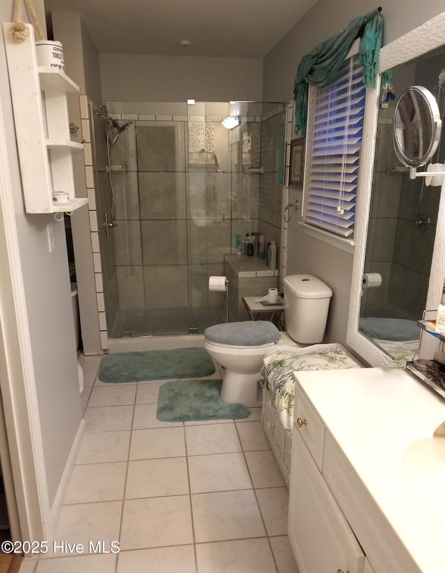 full bath featuring toilet, a shower stall, tile patterned flooring, and vanity