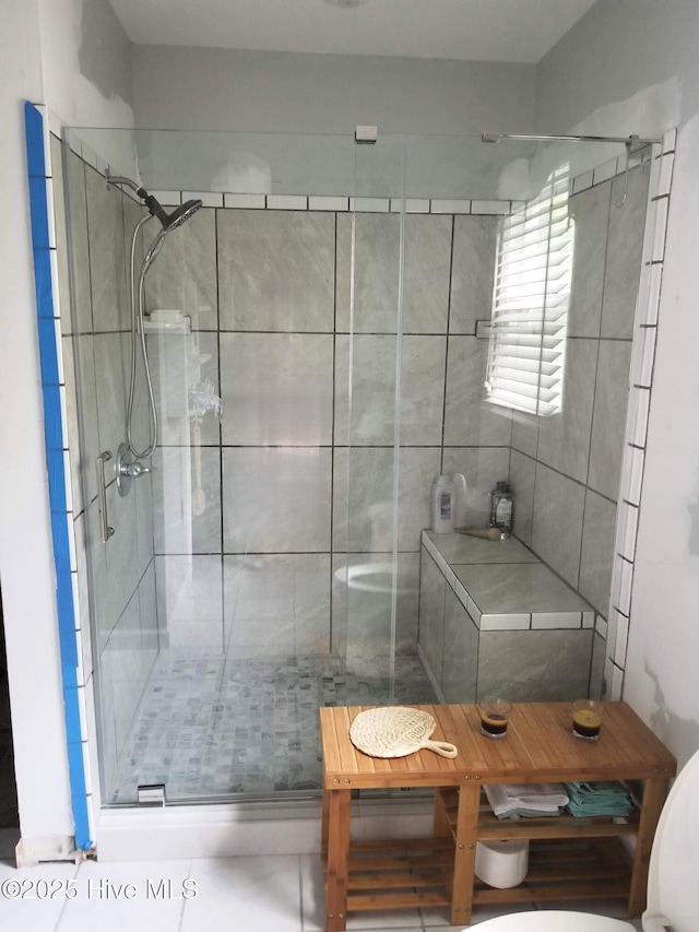 full bath featuring a shower stall