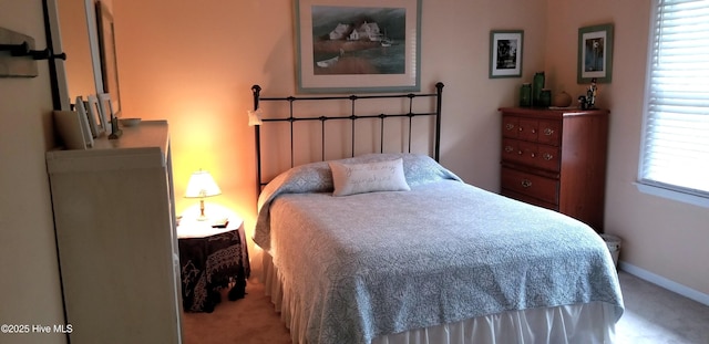 carpeted bedroom with baseboards
