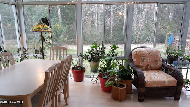 sunroom with wood finished floors and a wealth of natural light