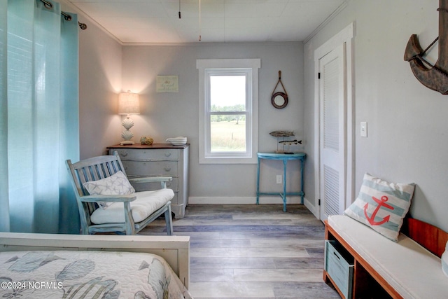 bedroom with wood finished floors and baseboards