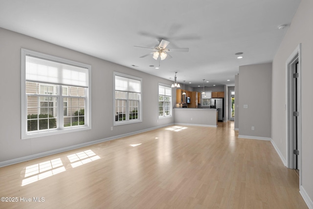 512 Village Green Dr Unit A, Morehead City, NC 28557 - unfurnished living room with ceiling fan, light wood-style floors, baseboards, and recessed lighting