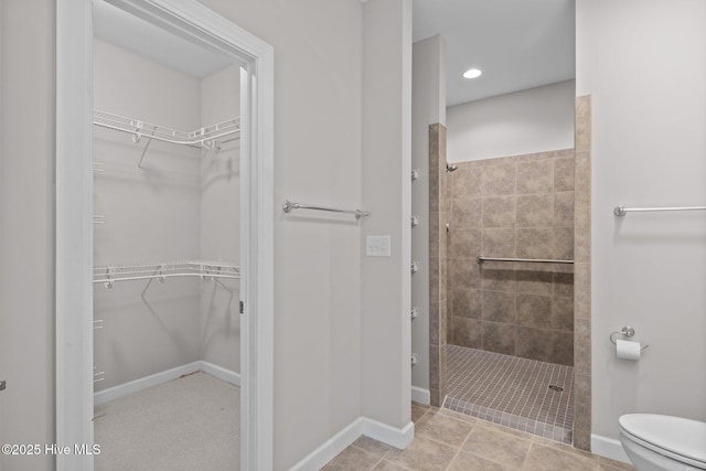 512 Village Green Dr Unit A, Morehead City, NC 28557 - full bathroom with a tile shower, toilet, baseboards, a spacious closet, and recessed lighting