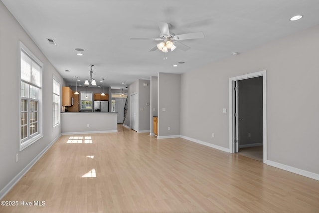 512 Village Green Dr Unit A, Morehead City, NC 28557 - unfurnished living room with light wood-style flooring, ceiling fan, baseboards, and recessed lighting