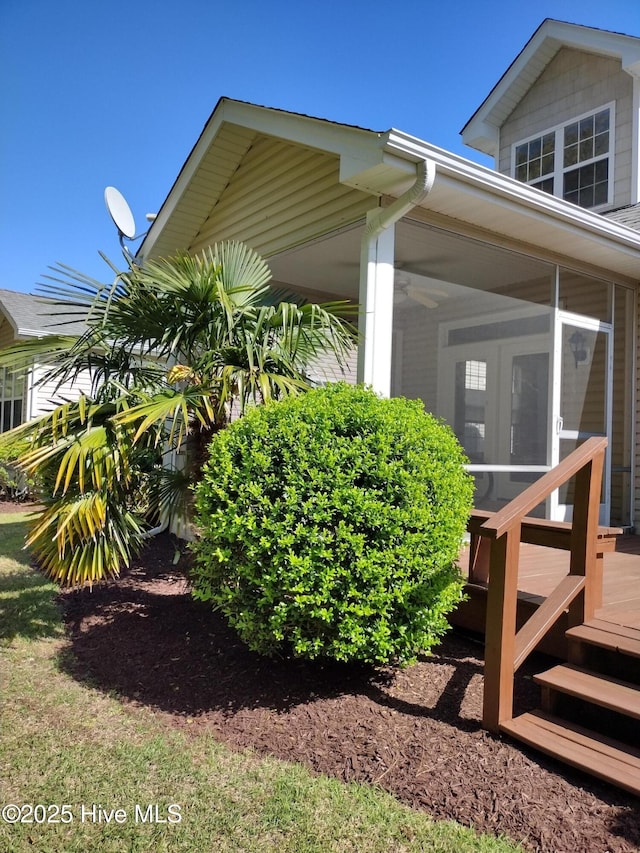 512 Village Green Dr Unit A, Morehead City, NC 28557 - view of home's exterior featuring a sunroom