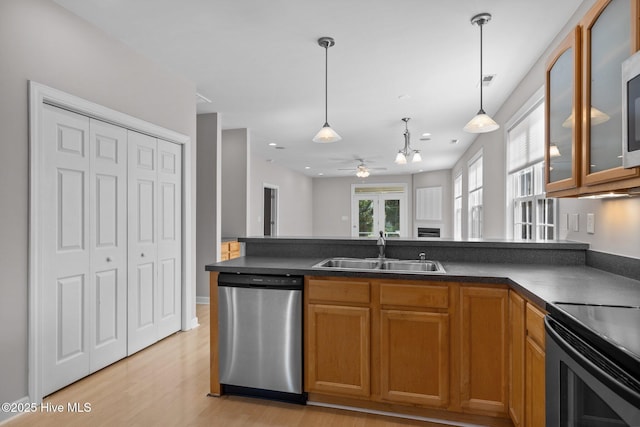 512 Village Green Dr Unit A, Morehead City, NC 28557 - kitchen featuring stainless steel dishwasher, a sink, a ceiling fan, light wood-style flooring, and a peninsula