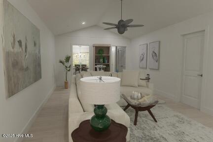 living room with ceiling fan, vaulted ceiling, and baseboards